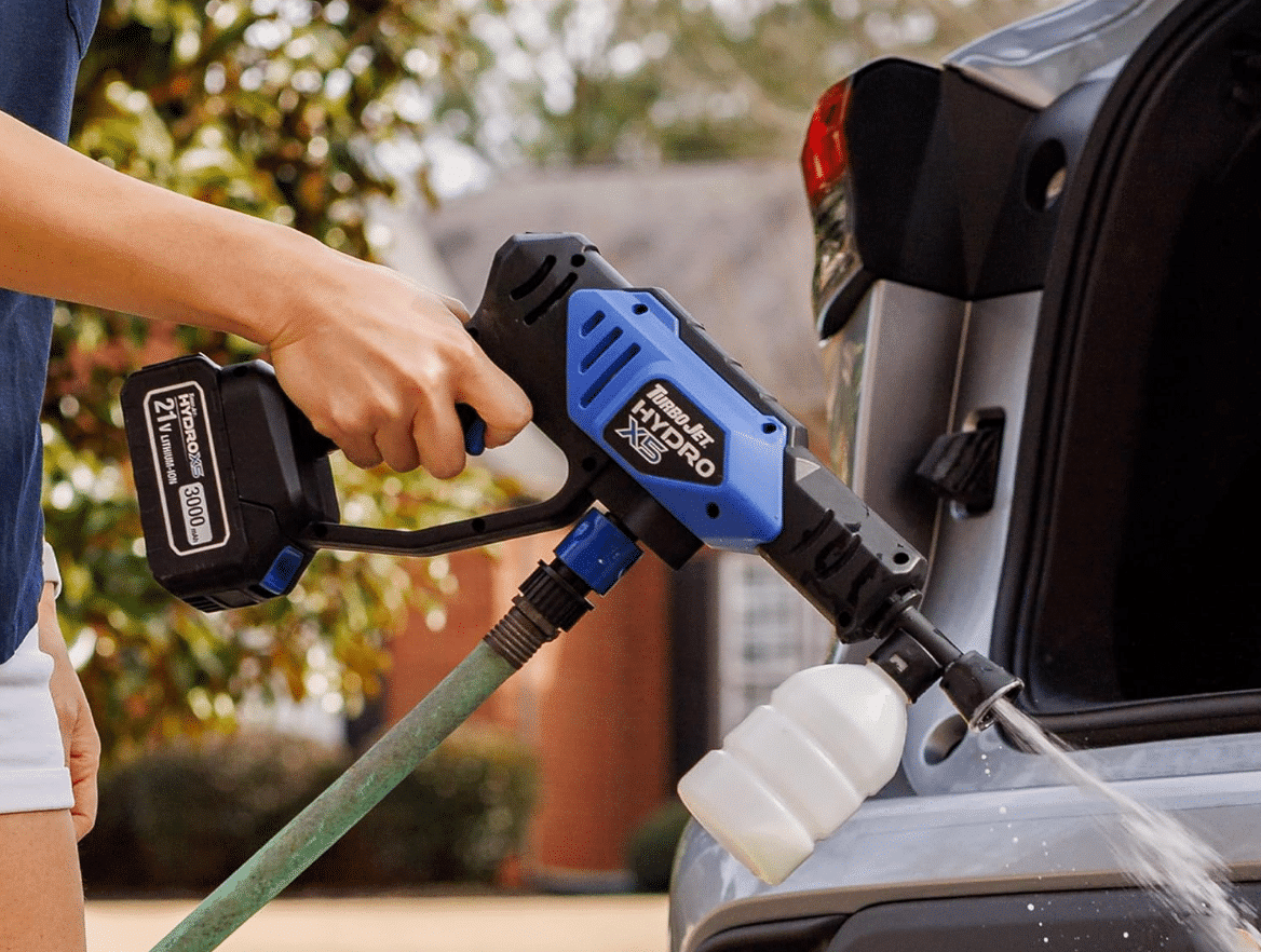 Real user cleaning car with HydroX5 cordless pressure washer